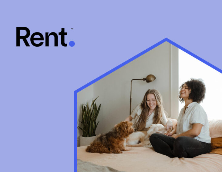 happy women and dog on bed